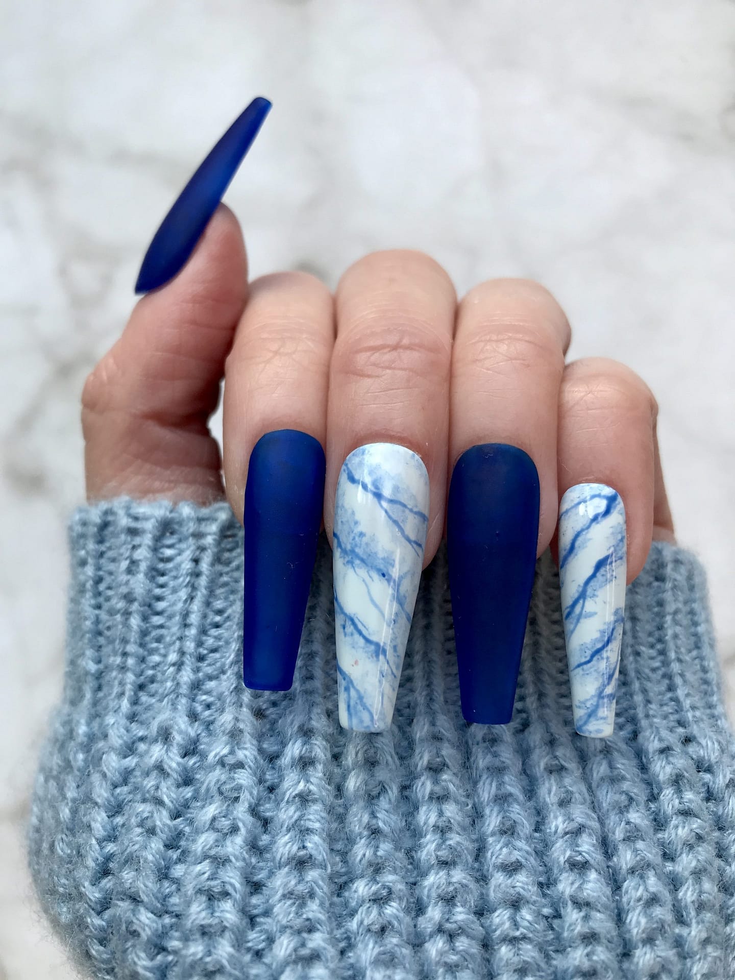 light blue and white marble nails